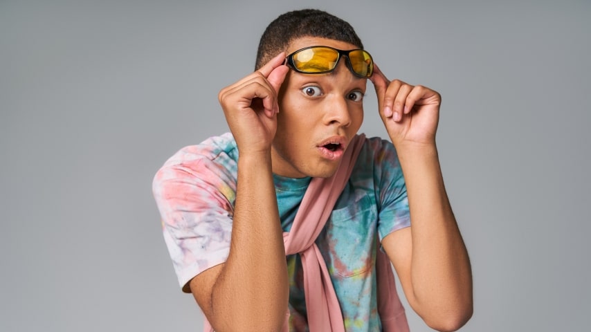 Disadvantages of Sublimation Printing A man wearing a colorful sublimation shirt in pastel tones.
