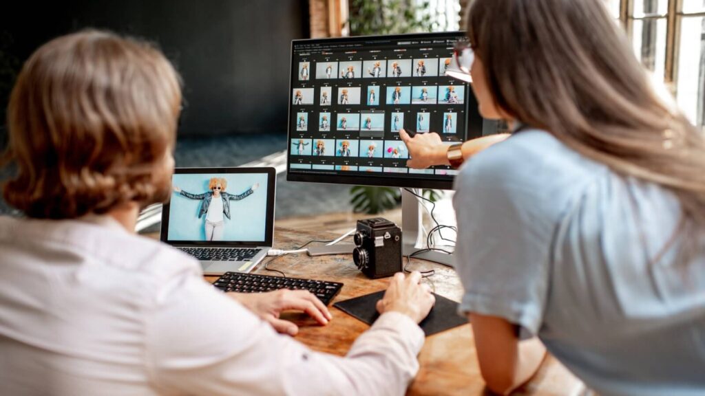 People selecting product pictures to edit.