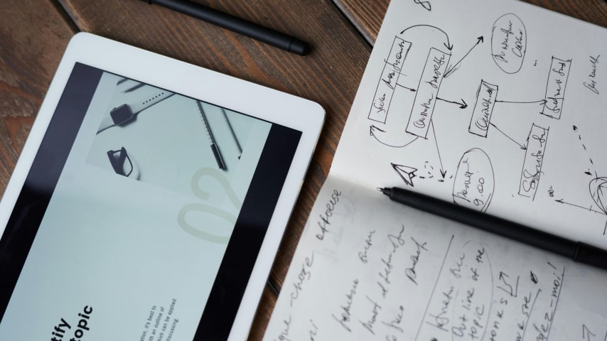 A notebook with written marketing materials.