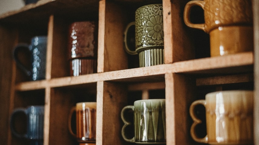 Start Selling Coffee Mugs on Etsy Mugs placed in shelves.