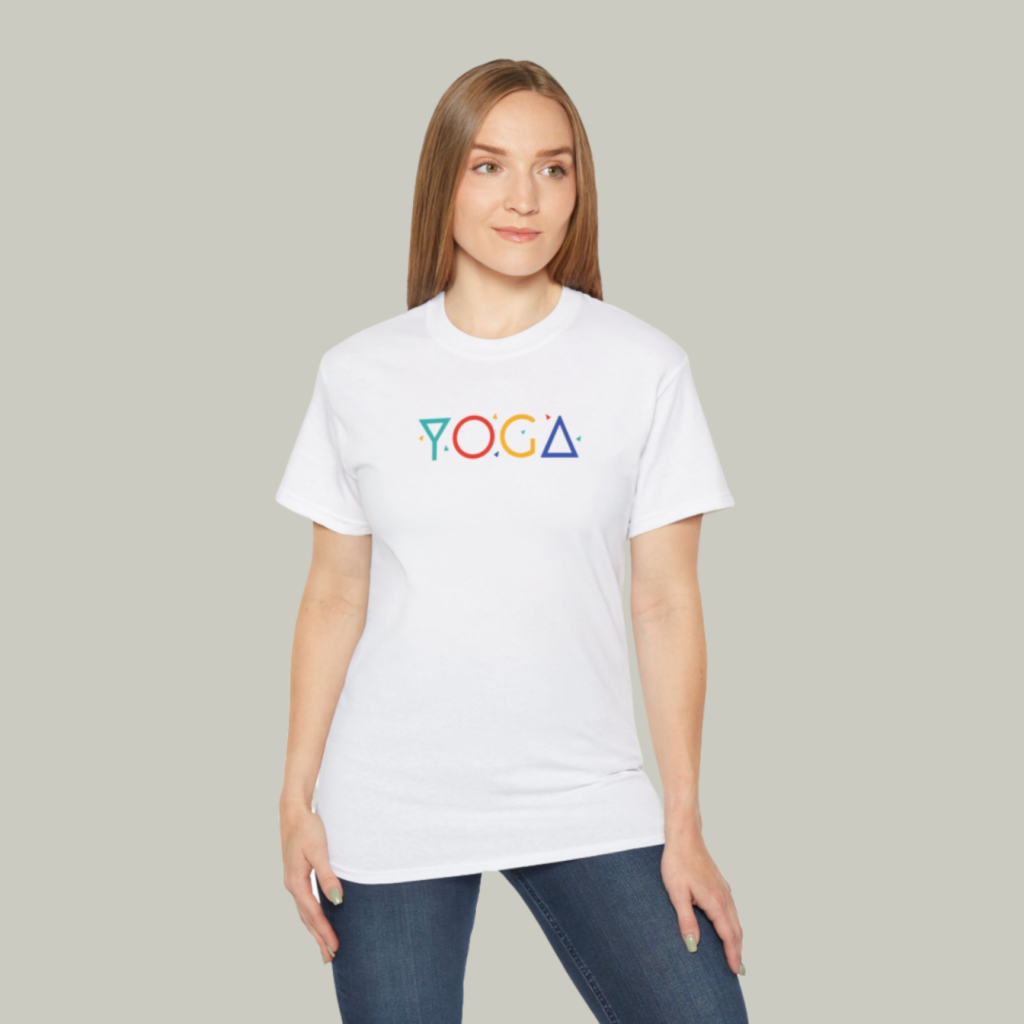 A mockup of a woman wearing a t-shirt with a custom “Yoga” print on a light-green background.