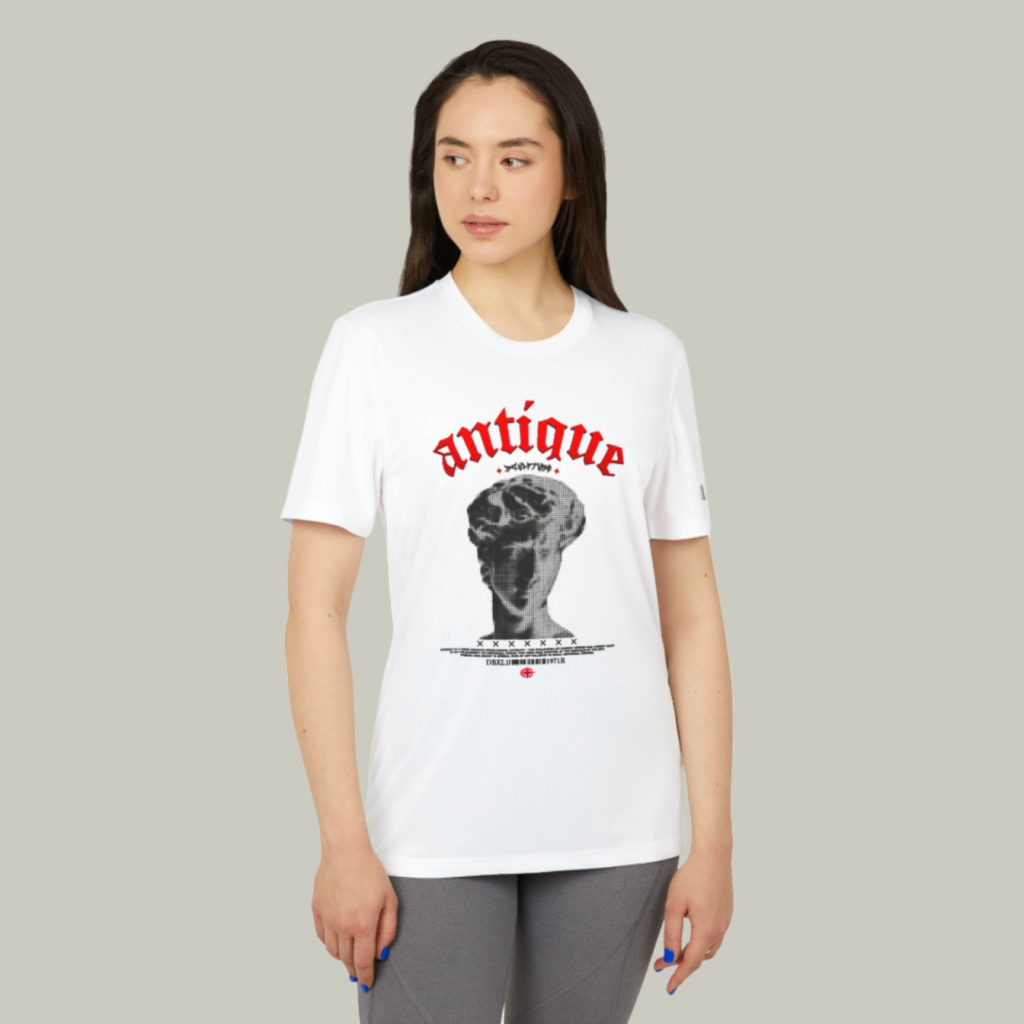 A mockup of a woman wearing a t-shirt with a custom “Antique” print on a light-green background.